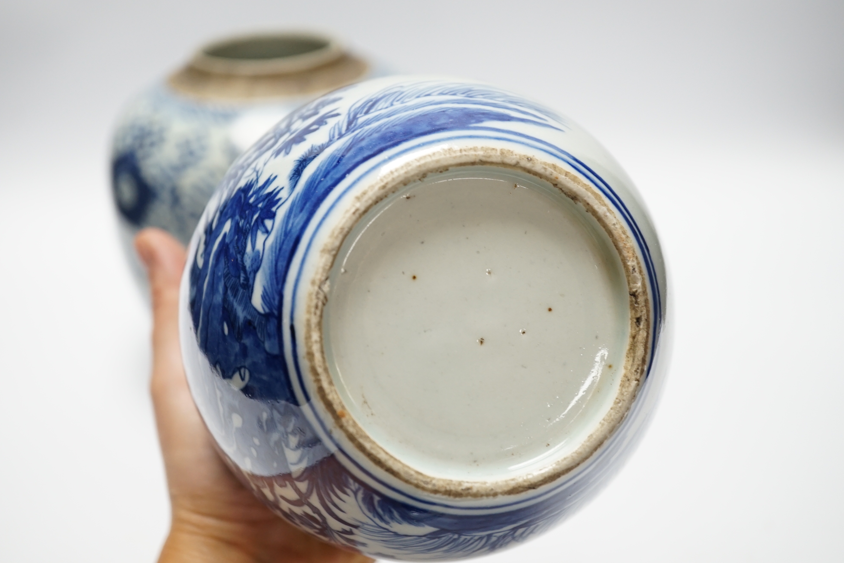 A Chinese blue and white jar and cover and another without cover, Qing dynasty and later largest 19cm high